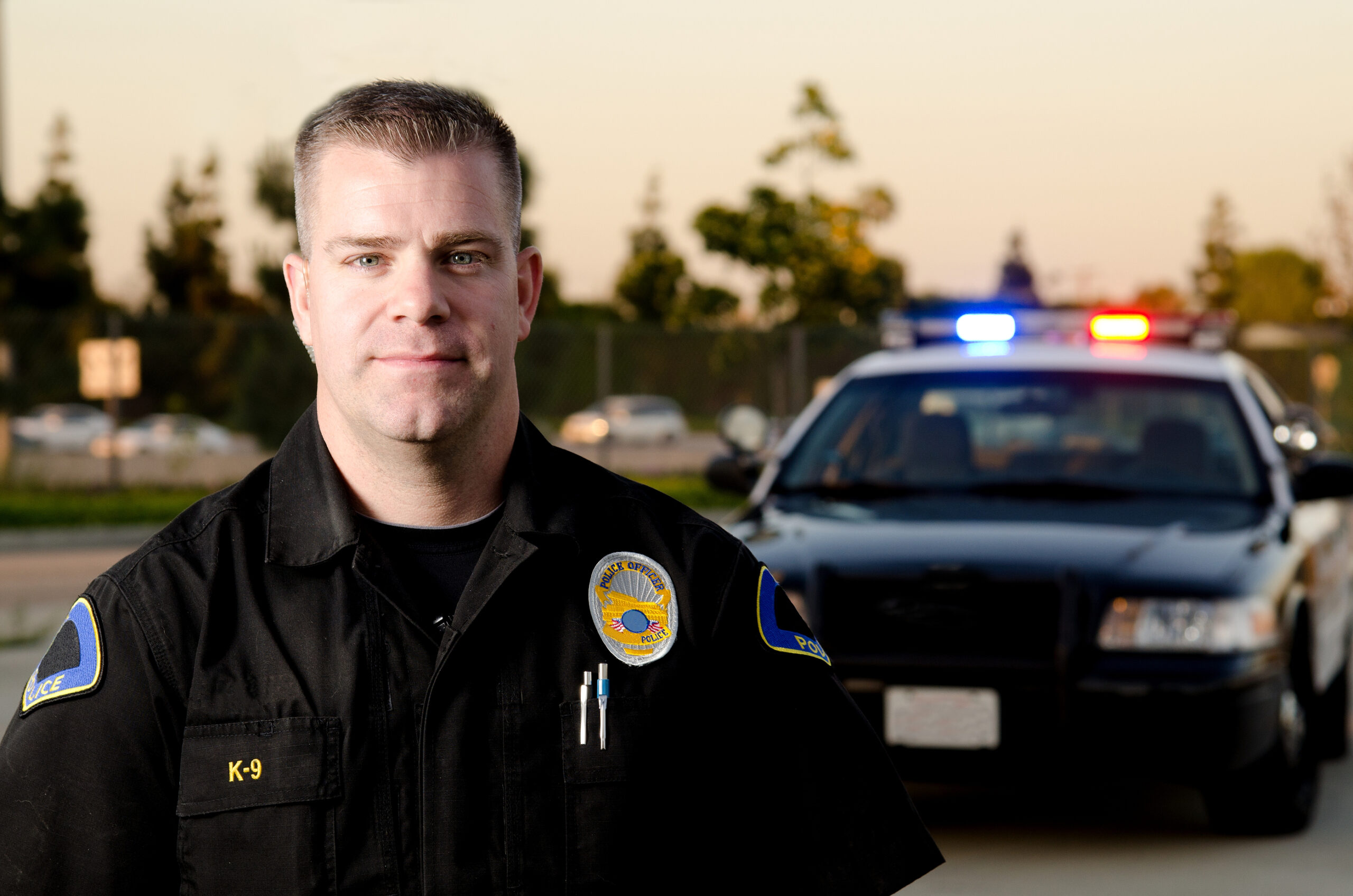 Cop with police car